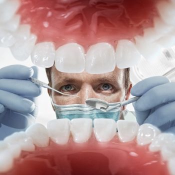 a dentist looking inside the mouth.