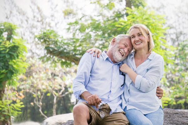 older man and woman smiling