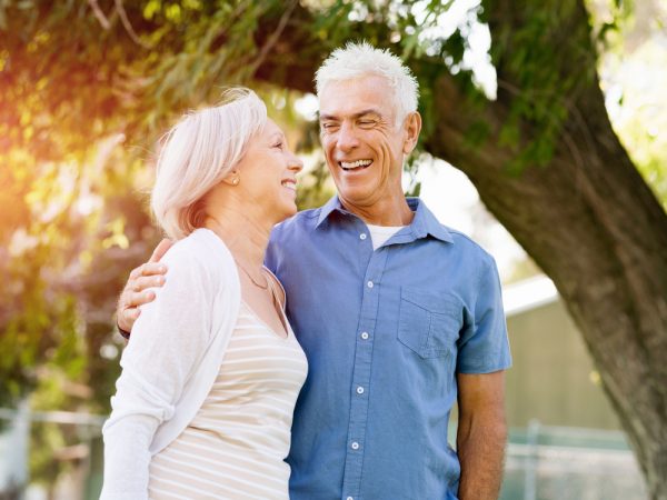 older man and woman smiling